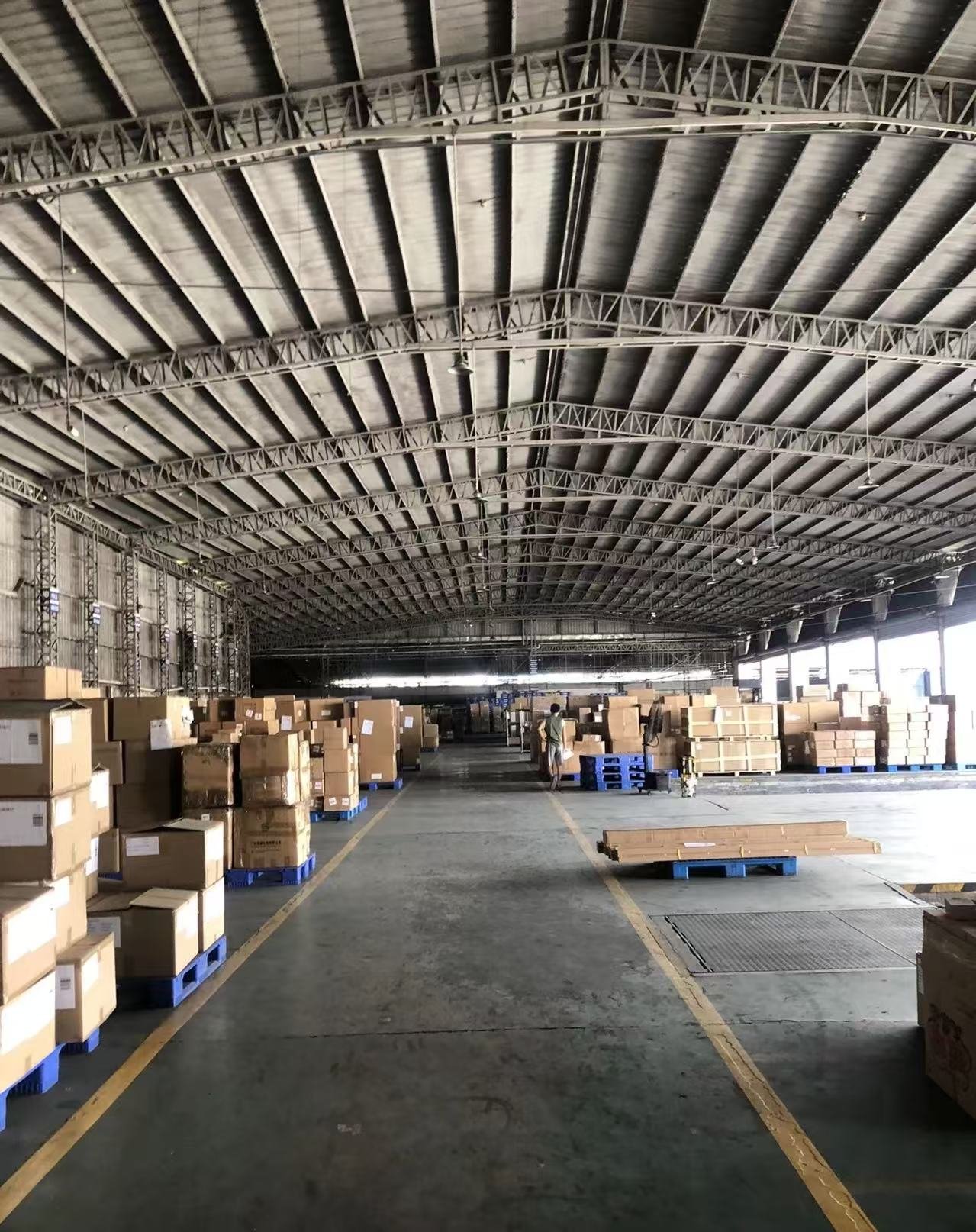 Yinghua Logistics warehouse interior with shelves of cargo boxes in Shenzhen, China