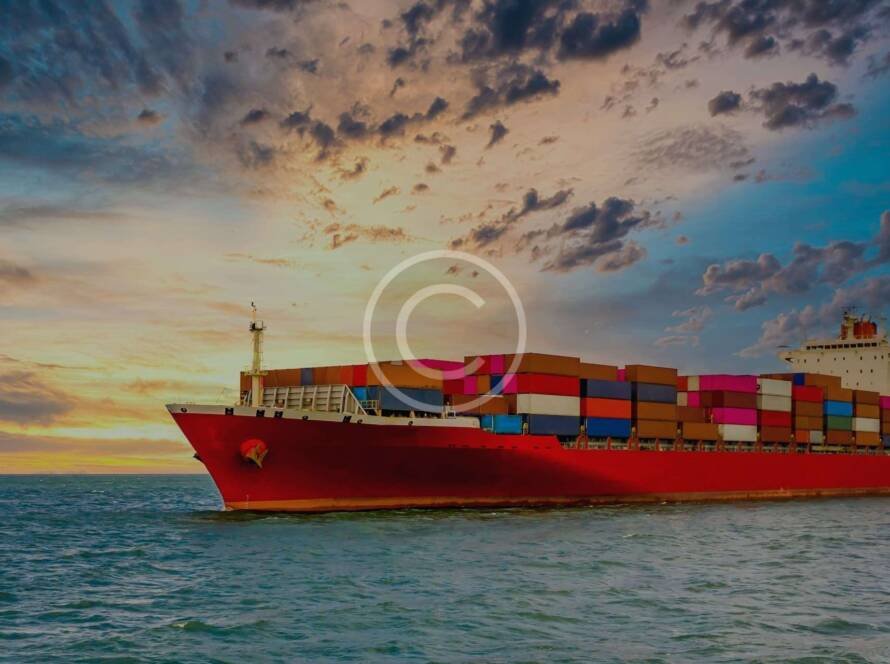 Container ship at sea representing global freight shipping costs